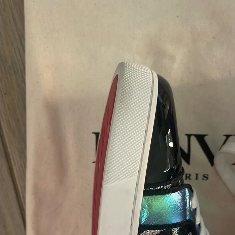 Black & Purple Women's Sneakers
made in Paris by Christian LOUBOUTIN
Red bottom - Picture 13 of 16